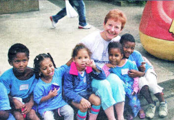 Beth McCabe with some of the children at Rio de Janeiro