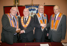  Bro Fred Willoughby (Worshipful District Master) and Bro Tom Kerr (Deputy District Master) are congratulated on their installation to the top and deputy posts for Lisburn District LOL No 6 by Bro William Thompson - County Grand Secretary (left) and Bro George Swain - District Secretary Hillsborough LOL No 19 (right).