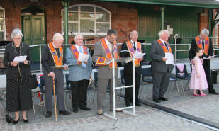 The platform party L to R: Mrs Mary Mattison, Bro Rev Gerry Sproule (District Chaplain), Bro Robert Murphy (District Lay Chaplain), Bro Maurice Coburn (Deputy District Master), Bro Eric Jess (Past District Master), Bro Norman Dewart (District Tyler) and Bro Mervyn Kernaghan (Second District Lecturer) and his daughter Victoria.