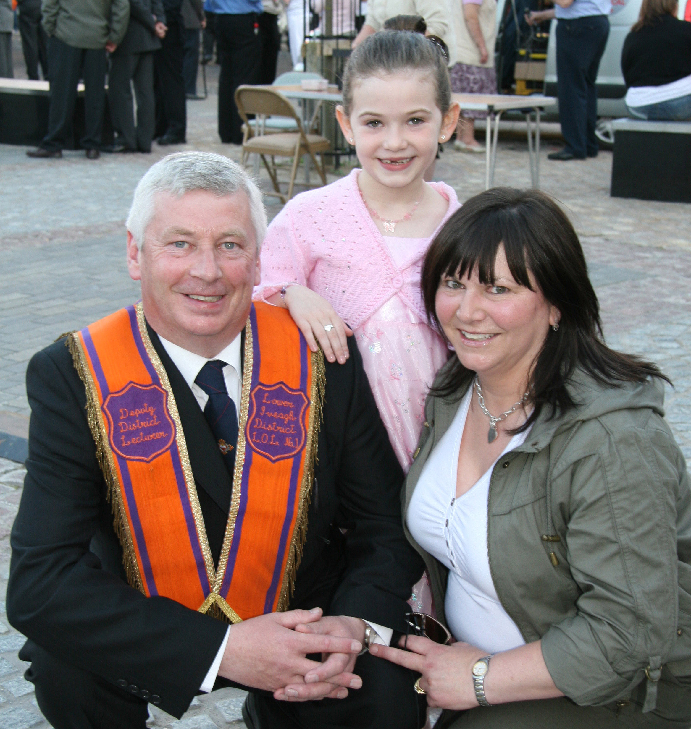 Dromara Primary School pupil, seven-year-old Victoria Kernaghan, who made a presentation to Mrs Mary Mattison at the opening the arch at Dromore on Wednesday 24th June, is pictured with her parents Mervyn and Linda. Second District Lecturer, Mervyn, is a member of Aughnaskeagh LOL No 1030.