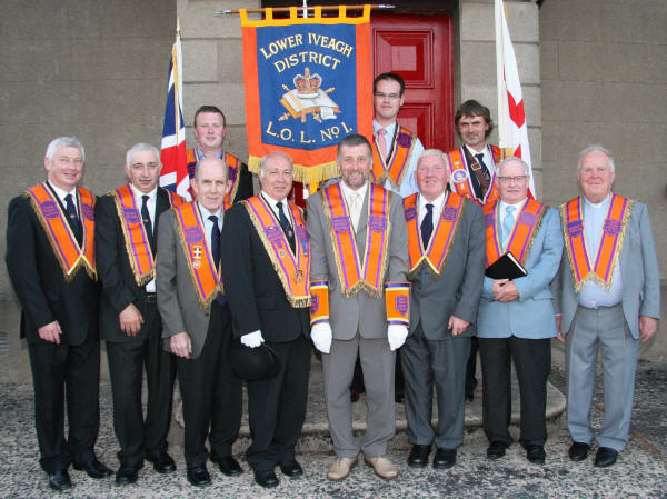 Lower Iveagh District LOL No 1 District Officers, pictured at the opening of the arch and mini twelfth parade at Dromore on Wednesday 24th June. L to R: Bro Mervyn Kernaghan (Second District Lecturer), Bro Alan Jess (First District Lecturer), Bro Harold Graham (District Treasurer), Bro Eric Jess (Past District Master), Bro Maurice Coburn (Deputy District Master), Bro Norman Dewart (District Tyler), Bro Robert Murphy (District Lay Chaplain) and Bro Rev Sam Peden (District Chaplain). (back row) Standard bearers - Bro Gareth Lough, Bro John Ward and Bro Geoffrey Bradford.
