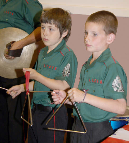 Lisburn Young Defenders youngest members Matthew Lowry and Peter Orr pictured playing the triangle during the band’s performance at an ‘Ulster Scots Gala and Dinner’
