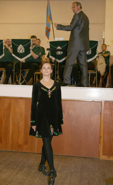 Naomi Orr pictured dancing to the music of Lisburn Young Defenders, of which she is drum major. Included is the band’s conductor, Mr Gary Shields.