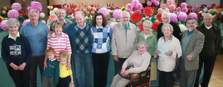 Mrs Joan Laverick and Victor Houston (left) pictured with some visitors to the North of Ireland Dahlia Society’s 33rd Annual Show in Hillsborough.