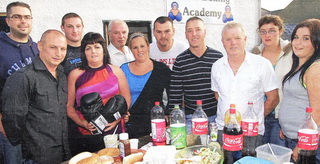 Committee members of the new Canal Boxing Academy, Gregg Street, enjoying a barbecue to mark the official opening.
