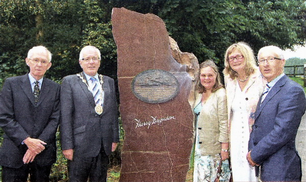 Ernie Cromie, chairman of the Ulster Aviation Society; Mayor Allen Ewart; Caroline Blest and Sally Fleming, grand-daughters of tractor inventor Harry Ferguson; and Bill Forsythe, from the Harry Ferguson Celebration Committee; at Hillsborough Forest Park where a memorial was unveiled to commemorate the Dromore man's famous first flight near Hillsborough lake 100 years ago in 1909. US3309-551cd