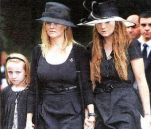 Mrs Hale and her daughters make their way into Hillsborough Parish Church. US3609-114A0