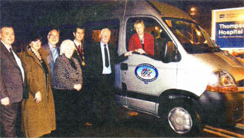 Gordon Moore, Carol McBurney, David Savage, Marie McStay, Alderman Edwin Poots, Ivan Coffey and Sister Edna Elliott in front of the new coach bought for Thompson House by the Friends and Relatives Committee.