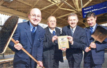 Pat Hunt, Lisburn Station Supervisor, receives a plaque from Gerard McAtarsney, Portadown Line Manager, alongside Customer Service Co-ordinators, Stephen Willis and David Hanlon.