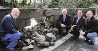 Councillor Allan Ewart and Edwin Poots MLA with local residents Tom Bryans and Kevin McWhinney, examing damage to the bridge at Legacurry which has led to the road between Lisburn and Annahilt being closed. US1409-527cd