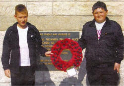 William Smyth and Lewis Heasley with a wreath laid by the school's at the Ulster Tower.