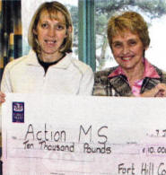 Fort Hill College teacher Diane Steel hands over a cheque for £10,000 to Anne Walker, Chief Executive of Action MS. US0109-515cd
