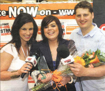 Citybeat's Emma Fitzpatrick and Stuart Robinson congratulate Lagmore girl Nicole Campbell on her win