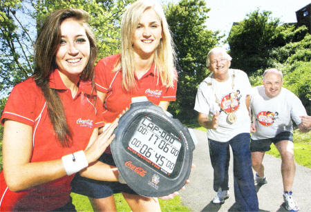 Coke girls Judith Wilson and Christine Jackson get set to time Mayor Ronnie Crawford and James Tinsley as they get into training for the Half-Marathon.