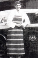 Robert Cumins standing beside one of the delivery vans at J M Cumins' butcher's shop in Bow Street in 1939.
