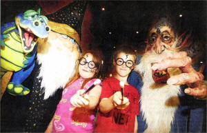 Amy Murray and Nathan McCard, both ten, with Bow Street Mall's resident Wizards during the Harry Potter theme day at the Mall. US3009-103A0 