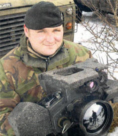 Corporal Darren Whymark (28), a member of the 2nd battalion The rifles displaying their equipment during the 19 Light Brigade Mission Rehearsal Exercise (MRX) at Salisbury Plain in England.