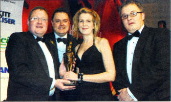 Lorna Kelly and Brian Graham are presented with their award by John Newbold Accu-Chek and Paul McDonagh, President of the Ulster Chemists' Association.