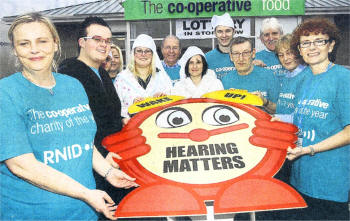 Staff of Co-Op Belsize road pictured with members of the Royal National Institute For the Deaf launching oyal National Institute For the Deaf as their charity of the year for 2009. US0509-120A0