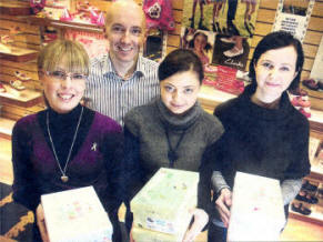 Paul Hicks, Linda Belshaw, Danuta Swadincka and Manika Domarska of Reids Shoes with some of the 300 pairs of Shoes which are being sent to Romania. US0809-105AQ Picture By: Aidan O'Reilly