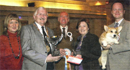 Show judge Mr Robin Newhouse from Manchester, who was assisted to present the prizes by the Mayor of Lisburn, Councillor Ronnie Crawford. The Honorary Secretary Mrs Heather Wilson (left) and Mary Davison, representing the sponsors of the event -Royal Canin pet foods, and Alan Matthew with his winning corgi.