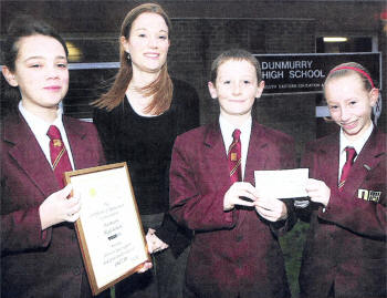 Dunmurry High School Year 8 pupils and top fundraisers Zoe Espie, Darren Crawford and Melissa Freeney present Rachel Burgoyne Fund Raiser for Northern Ireland Cancer Fund for Children with a cheque of £617. USO409-101A0 Picture By: Aidan O'Reilly
