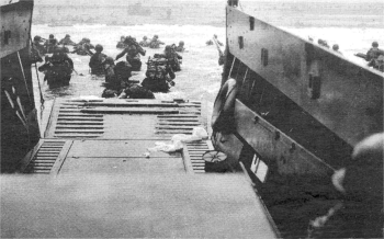 Troops leave landing vessels during the D-Day landings in Normandy which marked the start of the Allied liberation of Nazi occupied Europe.