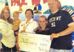 Little Reece Orr with parents Karen and Wayne and ten-year-old Victoria Lindsay 