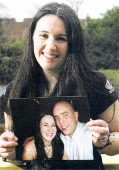 Caroline Clark holding a photograph of her husband Ben Clark, who was killed in a motorcycle accident outside Hillsborough in 2007. Picture by BRIAN LITTLE