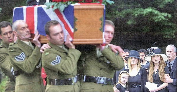 A final farewell. Captain Mark Hale's family look on as his army colleagues carry his coffin to the funeral service at Hillsborough Parish Church. Pic by Aidan O'Rreilly