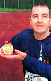 Lance Corporal Kenneth Livingstone with his medal for completing the New York Marathon.