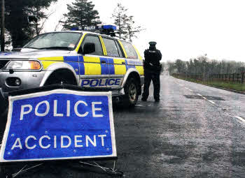 Police at the scene of the accident on the Glenavy Road on Wednesday.