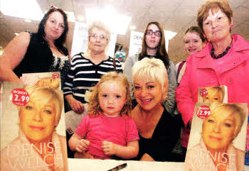 Denise Welch picture with some local people during her book signing at Eason's in Bow Street on Friday. US2110-108A0
	