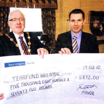 The Mayor of Lisburn, Councillor Allan Ewart presents a cheque to Mr Tim Magowan, Director of Tearfund Northern Ireland for the significant sum of £5872.
	