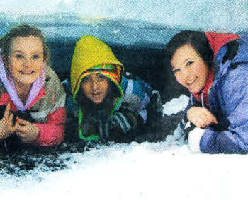 Friends' pupils Sarah Mathewson, Lauran Gamble and Claire Jordan crawling through the Solheimajokul glacier during their recent Geography trip to Iceland.
	
