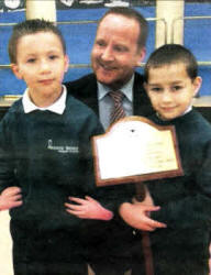 Joshua Fletcher and Brian Kerr with the principal of Meadowbridge Primary School, Mr Good. 