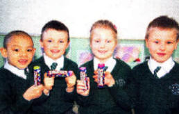 Primary two children who collected over £200 by filling up their smartie boxes.
	