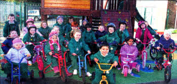 Nursery children who collected money by taking part in a sponsored bicycle ride.
	