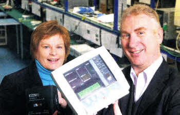 Dr Vicky Kell, lnvest Nl Director of Trade, with Dr Andy Barr, G-Care's Chief Executive, with one of G-Care's vital signs monitor
	