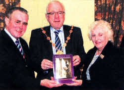 Harry Shortt (Chairman) and Pearl Finn (Secretary) pictured presenting a copy of 'Beloved Of My Heart - Little Hillsborough Town' the Mayor, Councillor Allan Ewart.
	