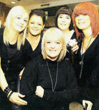 Jackie Girvan, centre, getting styled by Peter Mark staff Ashton Shaw, Sinead Donnelly, Maria Catney and Claire Poots as part of a fundraising day at the hairdressing salon for Autism NI. US0610-554cd
