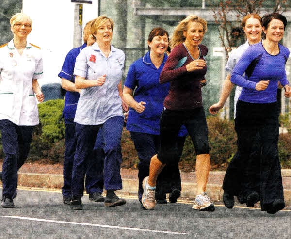 Teresa Mangur, Ward Manager and Ruth Magill, a member of Lagan Valley Athletic Club, lead the training around the grounds of the Ulster Hospital with Emma Savage, Vicky Gately, Sharon McKeown, Claire Jamison, Rosemary Ashemhurst, Joanne McClune, following behind.