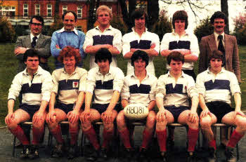 Simon, second left in the front row, in the rugby team at Wallace High School
	