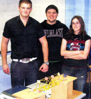 (L-R) Lisburn student Simon Gawith with Brian Morgan and Keisha Breen with a support bridge that was constructed during the competition.