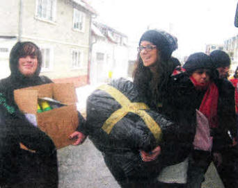 Laura Waterworth and Megan Boe delivering goods during the trip to Romania by St Patrick's Academy