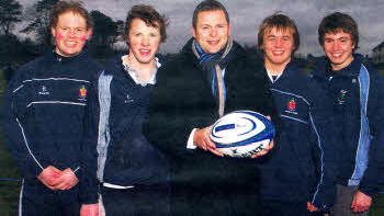 Wallace High School Rugby team captain Kyle McCall and team-mates Christopher Spence, Matthew Godfrey and Jamie Clements with Peter Hunniford, Lisburn branch Northern Bank pictured before their training session.