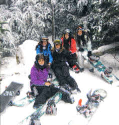 Snow boarders from The Wallace High School take a break at Loon Mountain, New Hampshire.
	