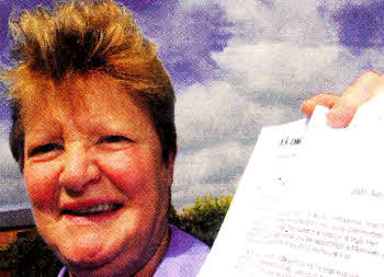 Anne Thompson with the letter she received confirming she has been awarded the MBE
	