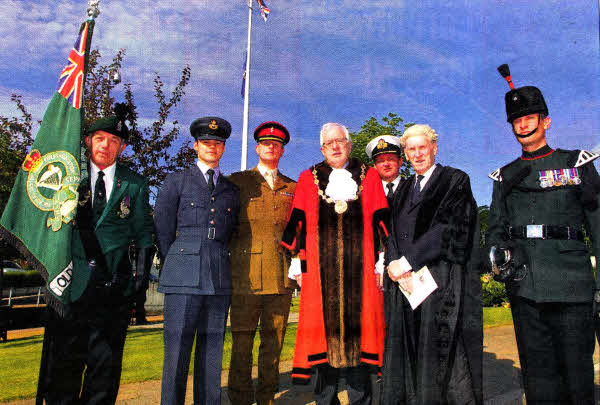 With the former Mayor of Lisburn, Councillor Allan Ewart at the recent ralsing of the Armed Forces Flag are (l-r): Mr Richard Hogg, Royal British Legion; Pilot Officer Griffiths, Royal Air Force; Lieutenant Colonel J Clarke, Royal lrish Regiment; Commander M Quinn, Royal Navy; Mr Norman Davidson, Chief Executive of Lisburn City Council and Lance Corporal Freedland, 2 Rifles.