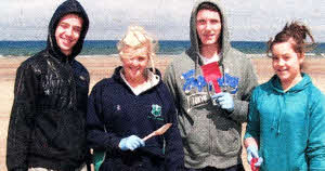 Sports students Matthew Gilvary, Rachel Hayes, Kenny Gracey and Hayley Cromie during the beach clean-up in Portstewart.
